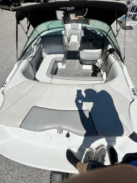 Slide: The Image of 2001 Cobalt 190 boat interior with seating and steering console. - 7