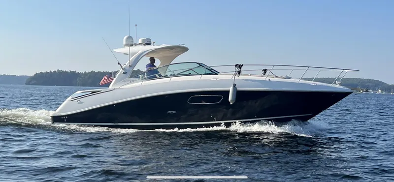 The Image of 2012 Sea Ray Sundancer 370 cruising on water in sunny weather. - 0
