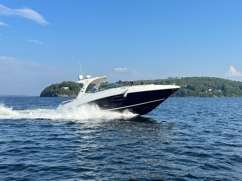 Slide: The Image of 2012 Sea Ray Sundancer 370 cruising on open water under sunny skies. - 10