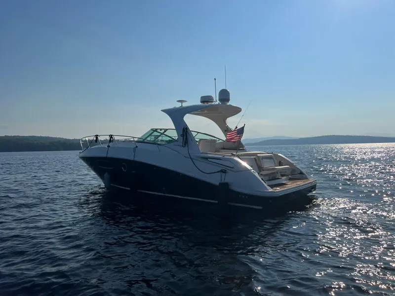 Slide: The Image of 2012 Sea Ray Sundancer 370 on calm waters at sunset. - 11