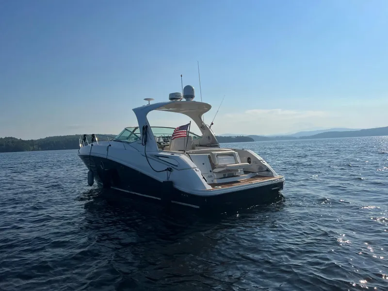 Slide: The Image of 2012 Sea Ray Sundancer 370 on calm waters at sunset. - 12
