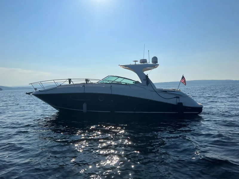 Slide: The Image of 2012 Sea Ray Sundancer 370 on calm waters at sunset. - 13