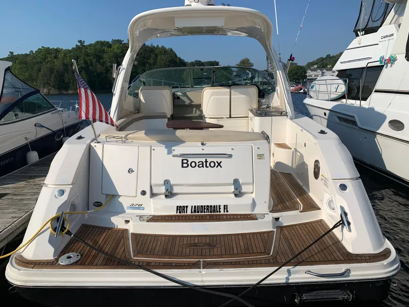 Slide: The Image of Rear view of a 2012 Sea Ray Sundancer 370 yacht docked. - 15