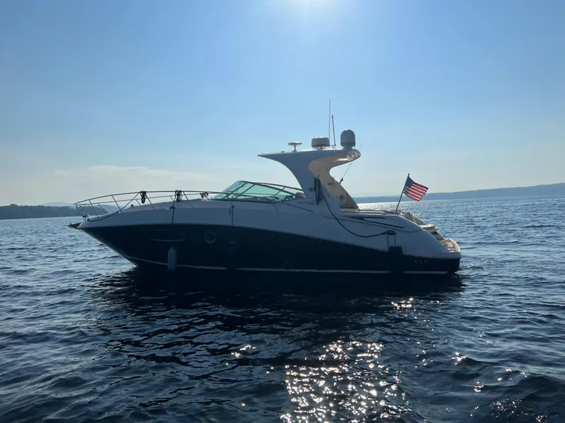Slide: The Image of 2012 Sea Ray Sundancer 370 on calm waters at sunset. - 17