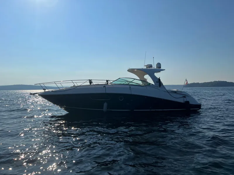 Slide: The Image of 2012 Sea Ray Sundancer 370 on calm waters at sunset. - 18