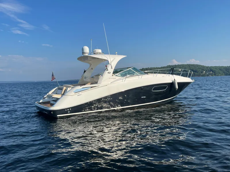 Slide: The Image of 2012 Sea Ray Sundancer 370 on calm waters. - 2