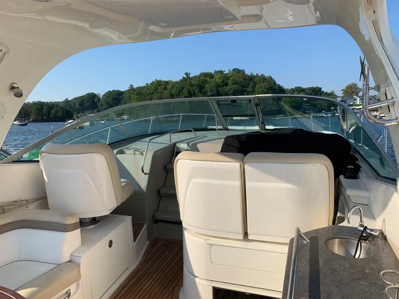 Slide: The Image of Interior of a 2012 Sea Ray Sundancer 370 yacht on a lake. - 23