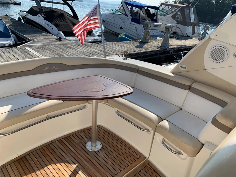 Slide: The Image of Interior of a 2012 Sea Ray Sundancer 370 yacht with seating area and table. - 25
