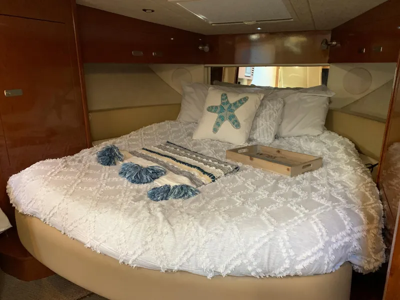 Slide: The Image of Sea Ray Sundancer 370 yacht interior, cozy bedroom with bed. - 29