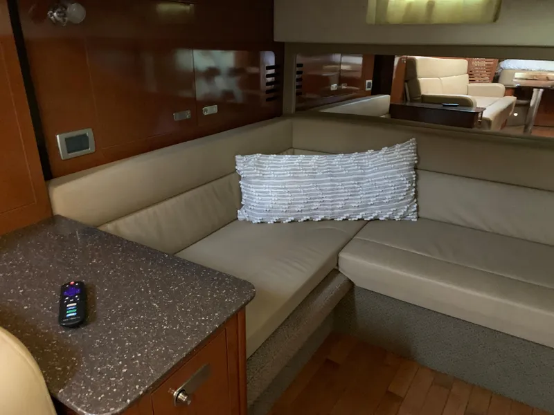 Slide: The Image of Interior of 2012 Sea Ray Sundancer 370 yacht with beige sofa and cushion. - 35