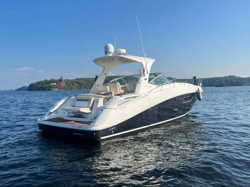 Slide: The Image of 2012 Sea Ray Sundancer 370 on calm water under sunny skies. - 4