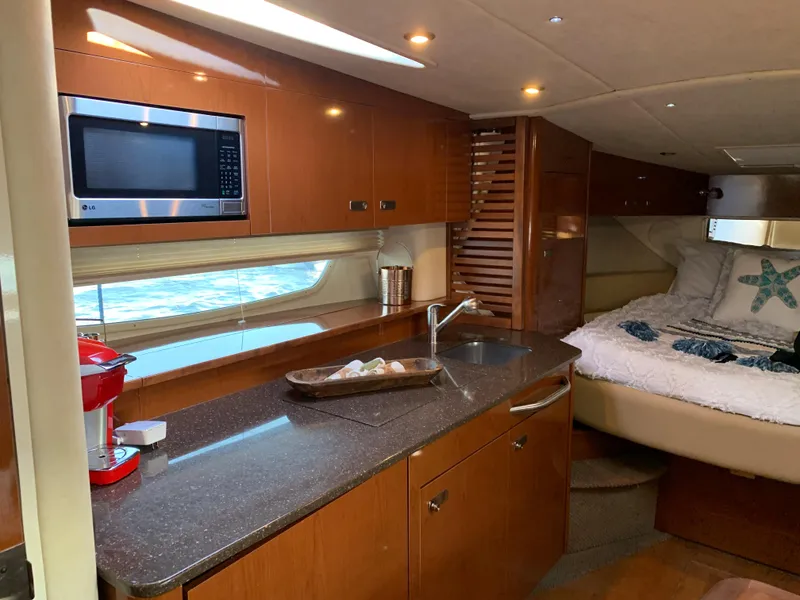 Slide: The Image of Interior of Sea Ray Sundancer 370 yacht, kitchen and sleeping area, 2012 model. - 40