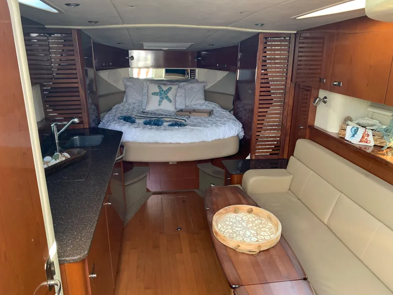 Slide: The Image of Interior of a 2012 Sea Ray Sundancer 370 yacht with bed and sofa. - 41