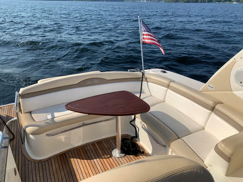 Slide: The Image of 2012 Sea Ray Sundancer 370 with seating area and table on the water. - 42