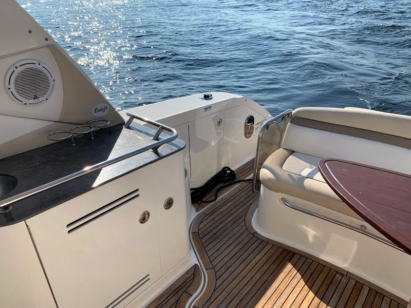 Slide: The Image of 2012 Sea Ray Sundancer 370 yacht deck with seating area and ocean view. - 43
