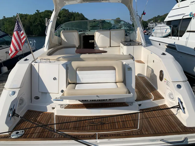 Slide: The Image of 2012 Sea Ray Sundancer 370 yacht with wooden deck and seating area. - 45