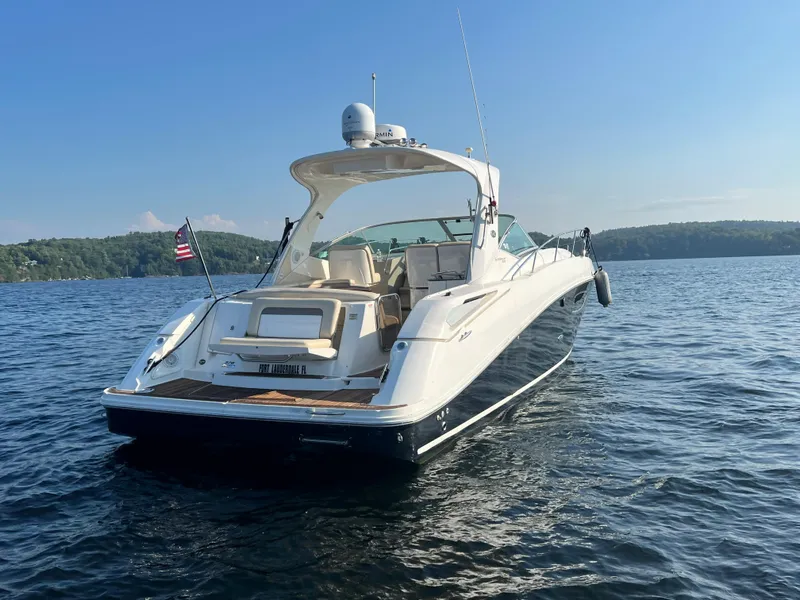 Slide: The Image of 2012 Sea Ray Sundancer 370 on calm water under sunny skies. - 5