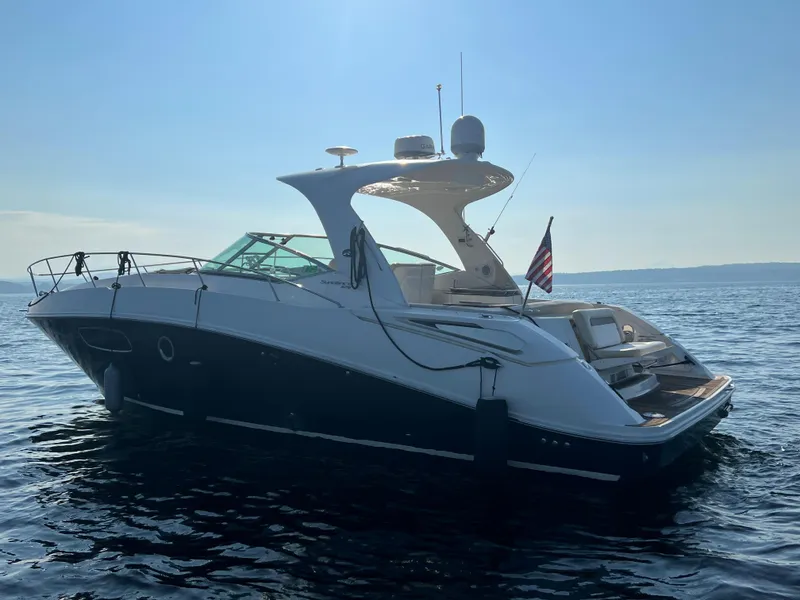 Slide: The Image of 2012 Sea Ray Sundancer 370 on calm waters at sunset. - 6