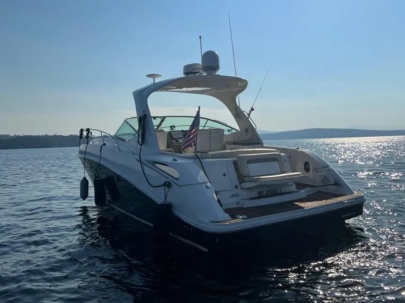 Slide: The Image of 2012 Sea Ray Sundancer 370 on calm water at sunset. - 7
