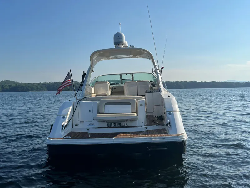 Slide: The Image of 2012 Sea Ray Sundancer 370 on calm water at sunset. - 8