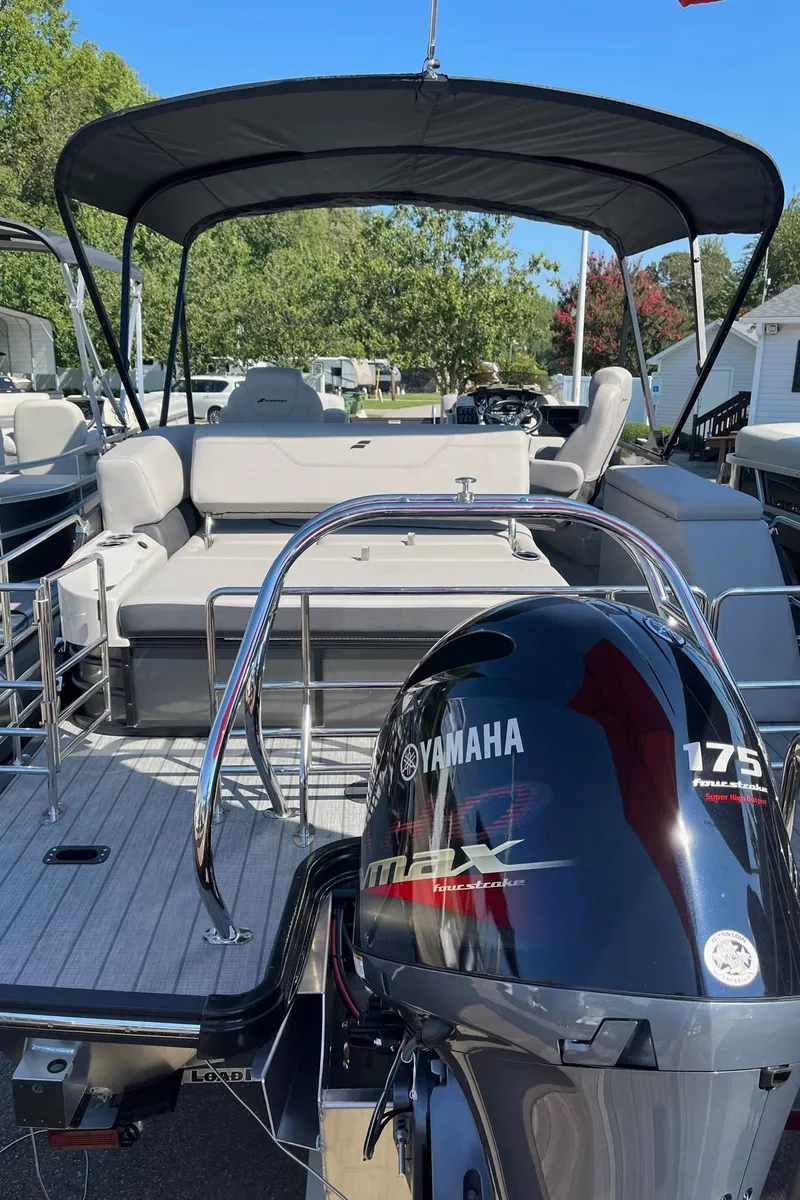 Slide: The Image of 2024 Starcraft SLS 3 Q DH pontoon boat with Yamaha 175 outboard motor. - 2