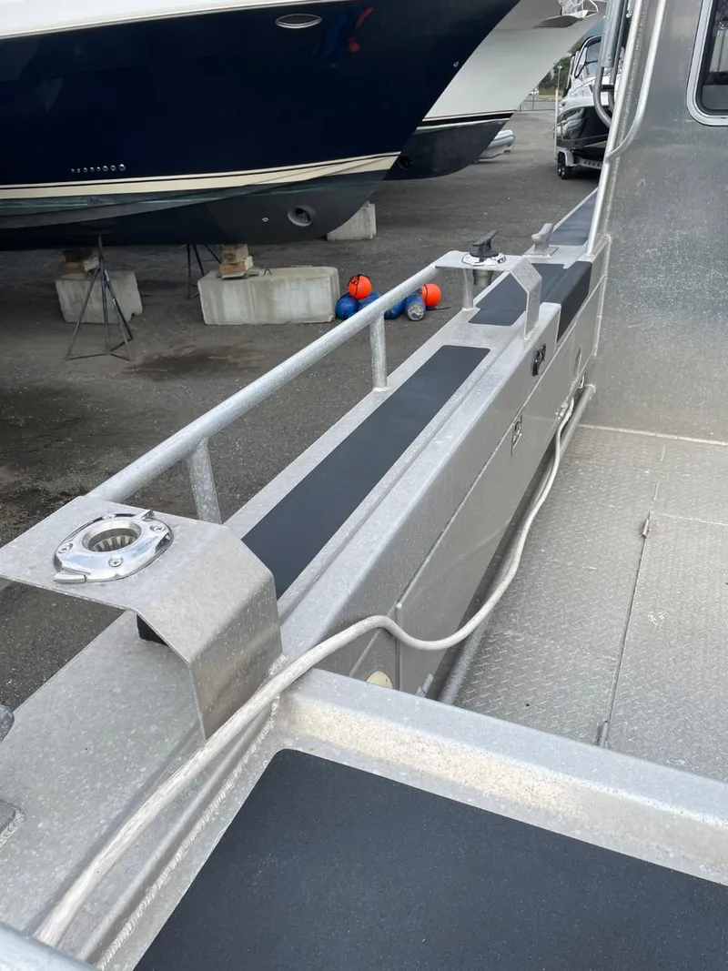 Slide: The Image of 2010 Glacier Craft Custom Aluminum boat deck in a marina. - 11