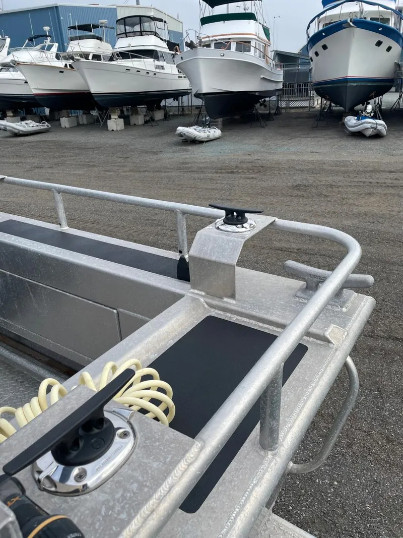 Slide: The Image of 2010 Glacier Craft Custom Aluminum boat in a marina with other boats. - 12