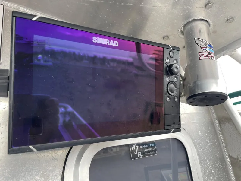 Slide: The Image of Simrad display on 2010 Glacier Craft Custom Aluminum boat dashboard. - 16
