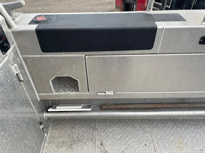 Slide: The Image of Interior of a 2010 Glacier Craft Custom Aluminum boat showing storage compartments. - 18