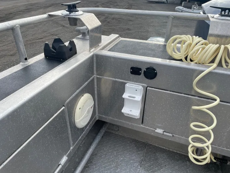 Slide: The Image of 2010 Glacier Craft Custom Aluminum boat interior with speaker, hose, and storage compartments. - 19