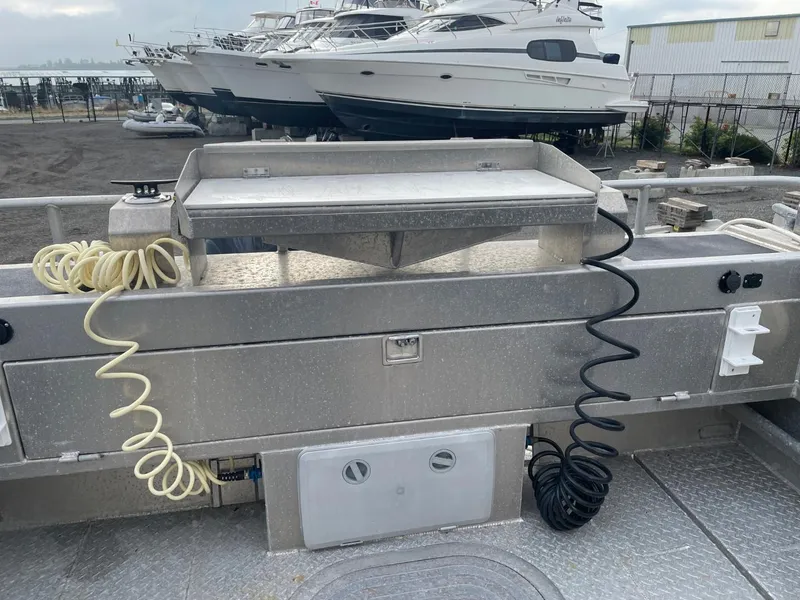 Slide: The Image of 2010 Glacier Craft Custom Aluminum boat with fishing station and coiled hoses. - 20