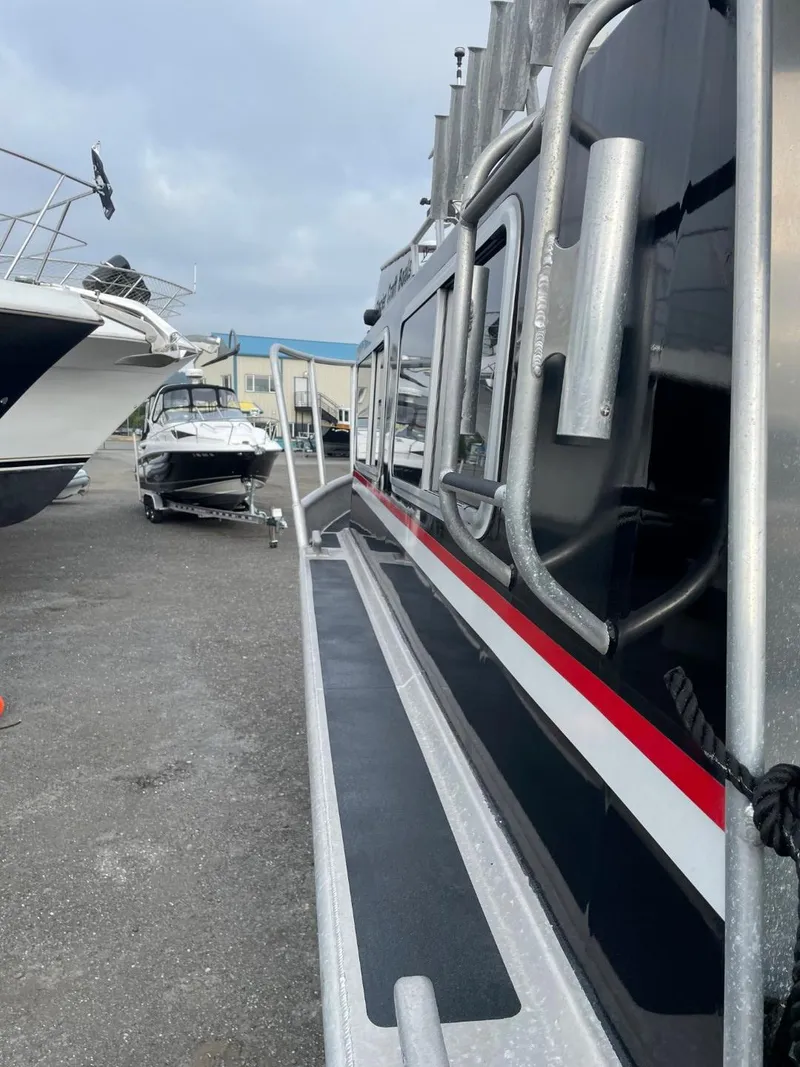 Slide: The Image of 2010 Glacier Craft Custom Aluminum boat docked at a marina. - 22