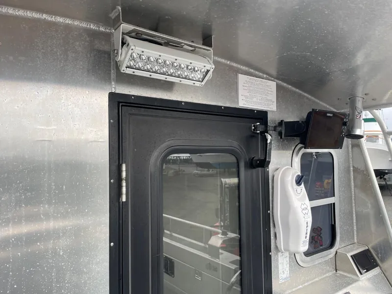 Slide: The Image of 2010 Glacier Craft Custom Aluminum boat with exterior lighting and door. - 25