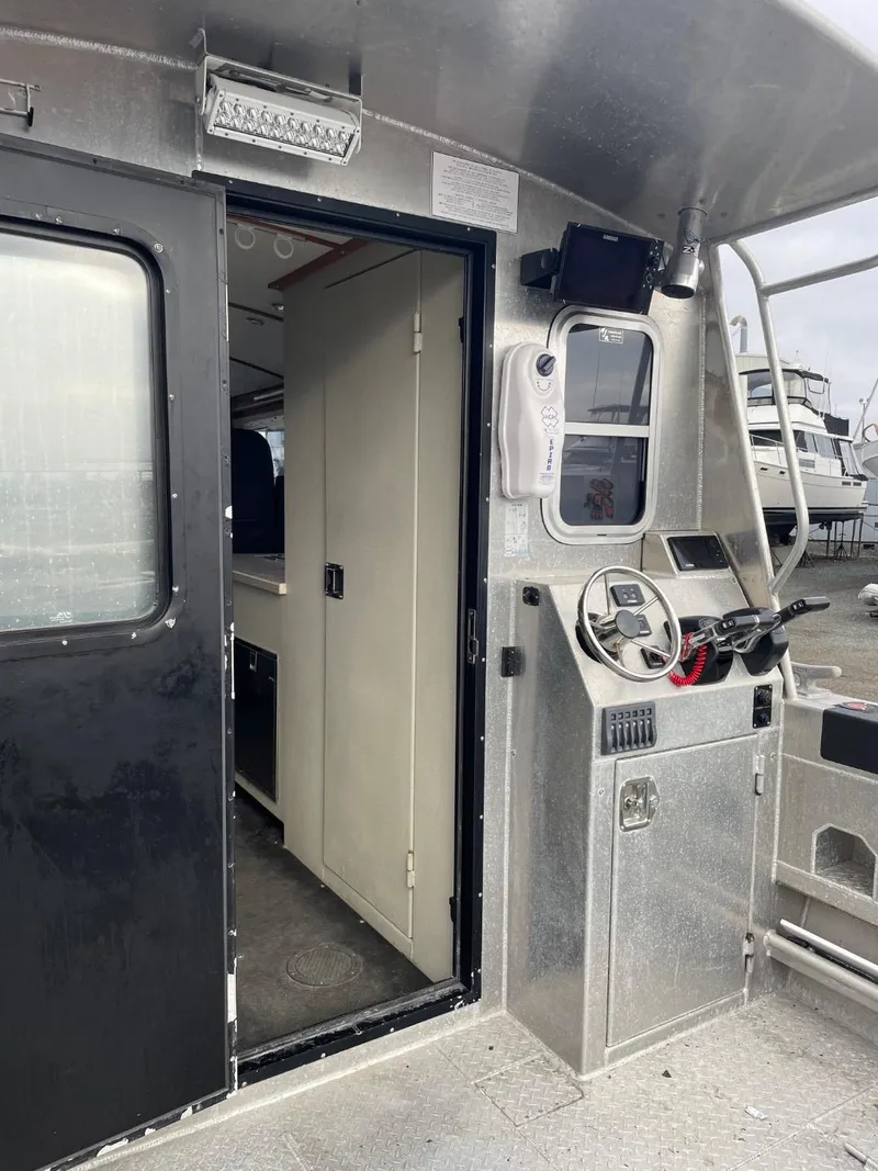 Slide: The Image of 2010 Glacier Craft Custom Aluminum boat interior with steering console. - 27