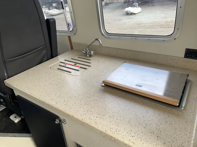 Slide: The Image of 2010 Glacier Craft Custom Aluminum boat interior with sink and countertop. - 31