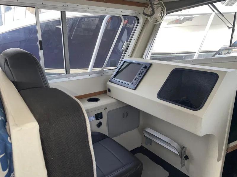 Slide: The Image of 2010 Glacier Craft Custom Aluminum boat interior with navigation system and captain's chair. - 37