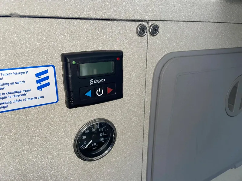 Slide: The Image of Control panel and gauge on a 2010 Glacier Craft Custom Aluminum boat. - 39