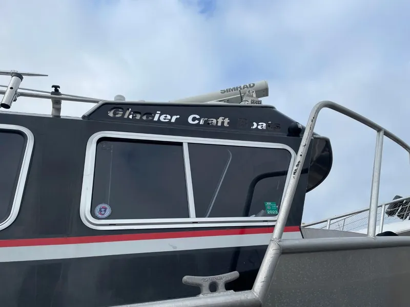Slide: The Image of 2010 Glacier Craft Custom Aluminum boat with Simrad radar against cloudy sky. - 5