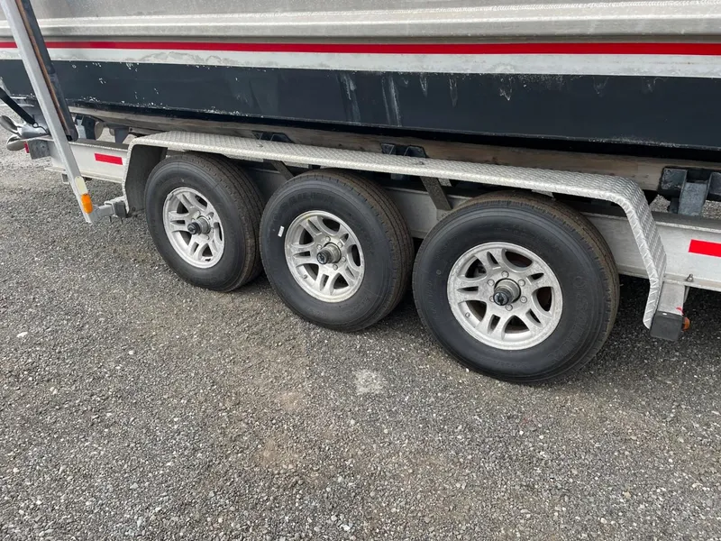 Slide: The Image of 2010 Glacier Craft Custom Aluminum boat trailer with triple axle wheels. - 7