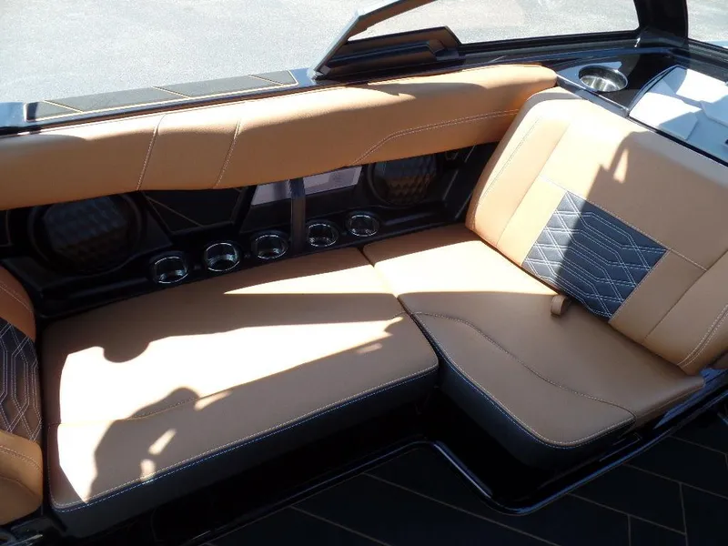 Slide: The Image of 2023 Malibu 26 LSV interior with tan leather seating and stylish design. - 11