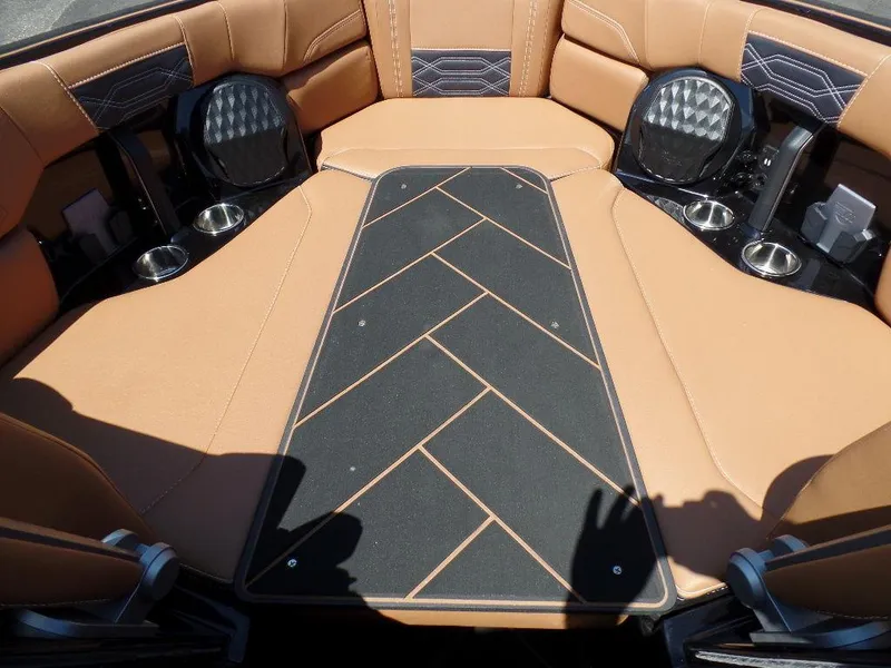 Slide: The Image of 2023 Malibu 26 LSV interior with tan upholstery and black accents. - 13