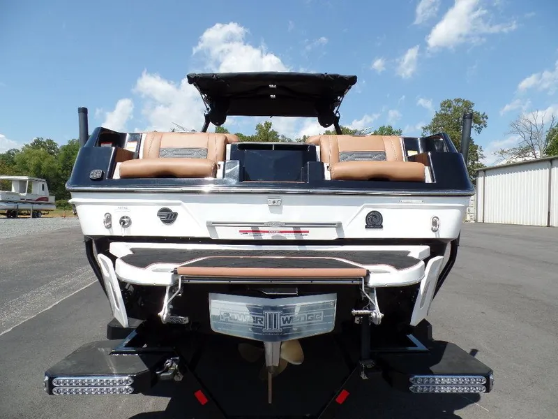Slide: The Image of 2023 Malibu 26 LSV boat, rear view, showcasing sleek design and luxurious seating. - 3