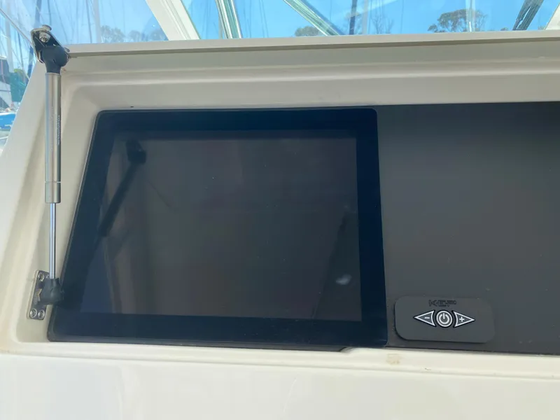 Slide: The Image of Control panel of a 2005 Cabo 40 Hardtop Express boat. - 18