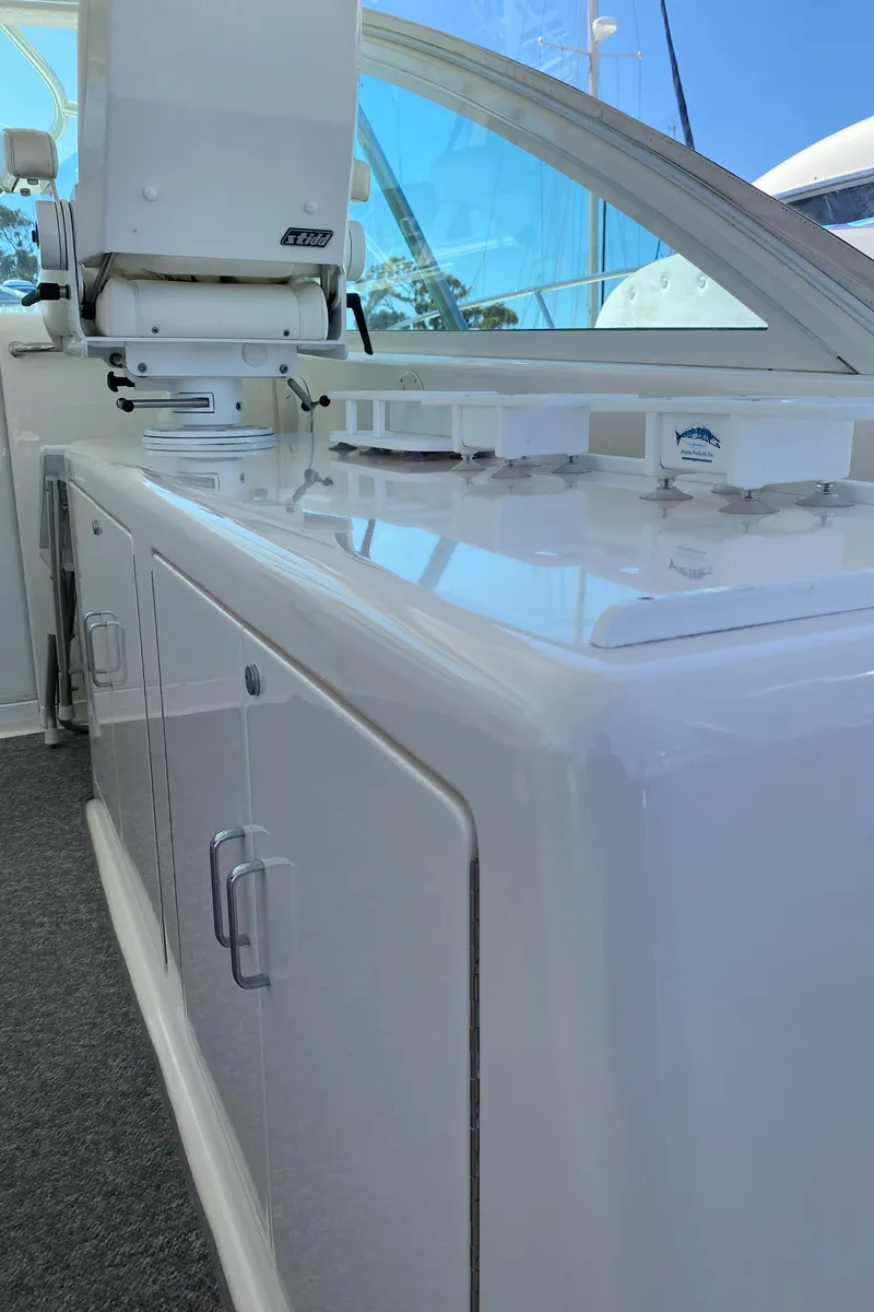 Slide: The Image of 2005 Cabo 40 Hardtop Express yacht interior with sleek white cabinetry and modern design. - 31