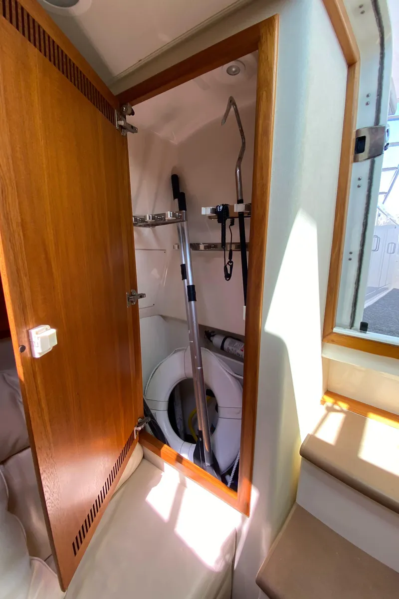 Slide: The Image of 2005 Cabo 40 Hardtop Express interior with washer and storage closet. - 39