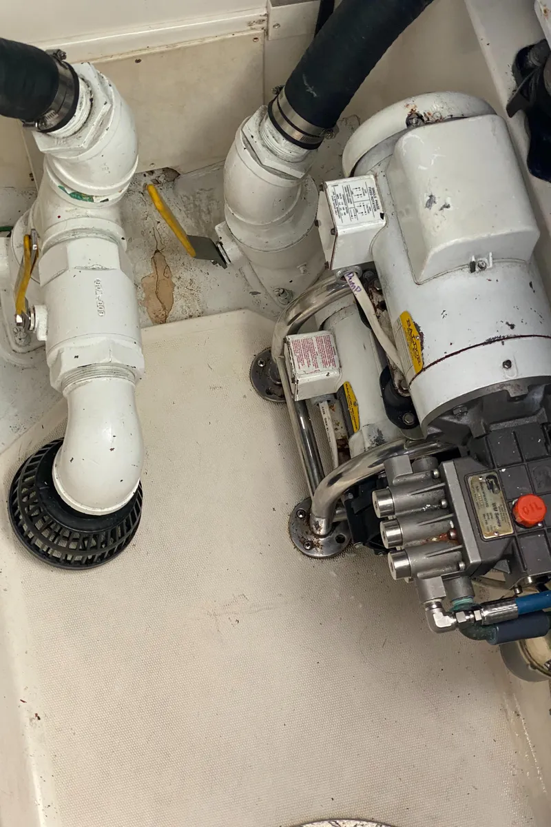 Slide: The Image of Engine room of 2005 Cabo 40 Hardtop Express with visible mechanical components. - 42