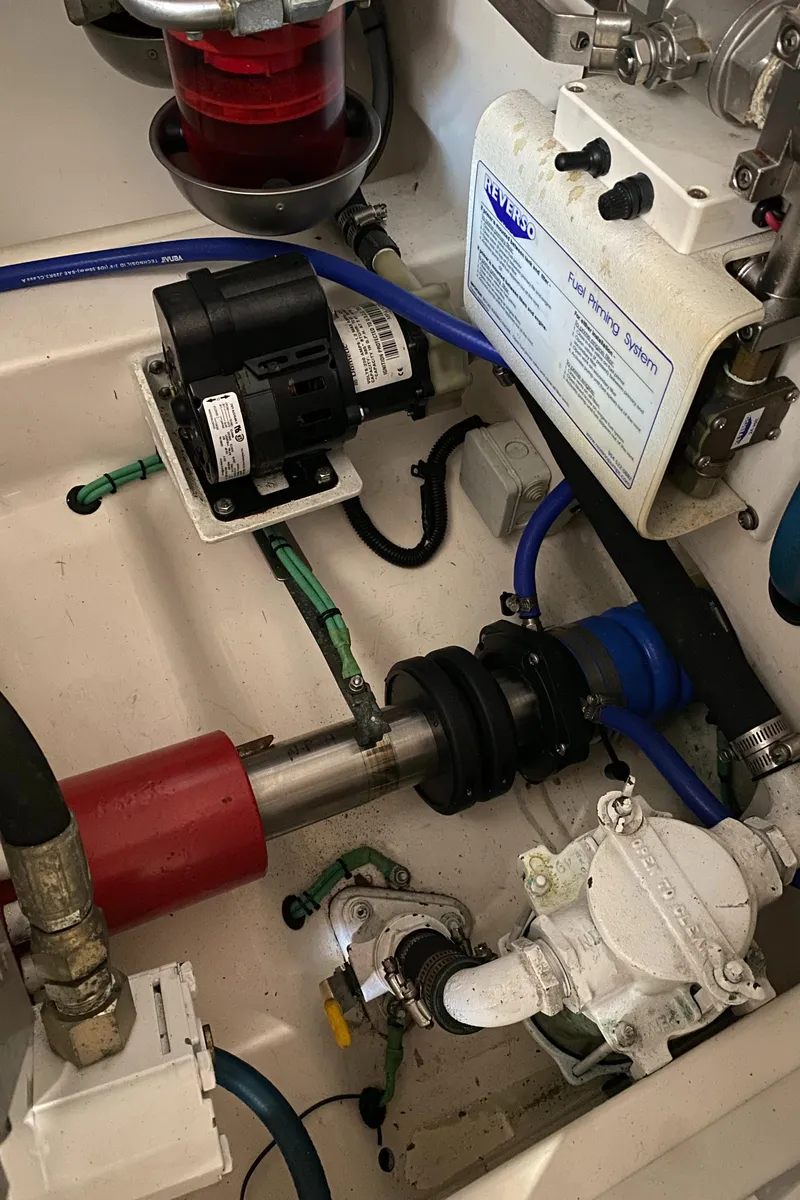 Slide: The Image of Engine compartment of a 2005 Cabo 40 Hardtop Express with visible mechanical components. - 43