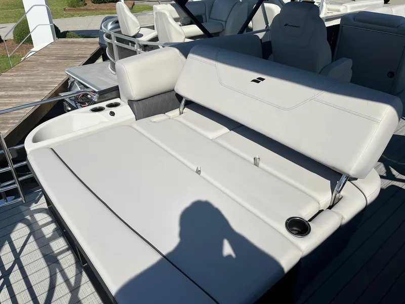 Slide: The Image of 2024 Starcraft SLS 3 Q DH boat with luxurious seating and cup holders. - 7