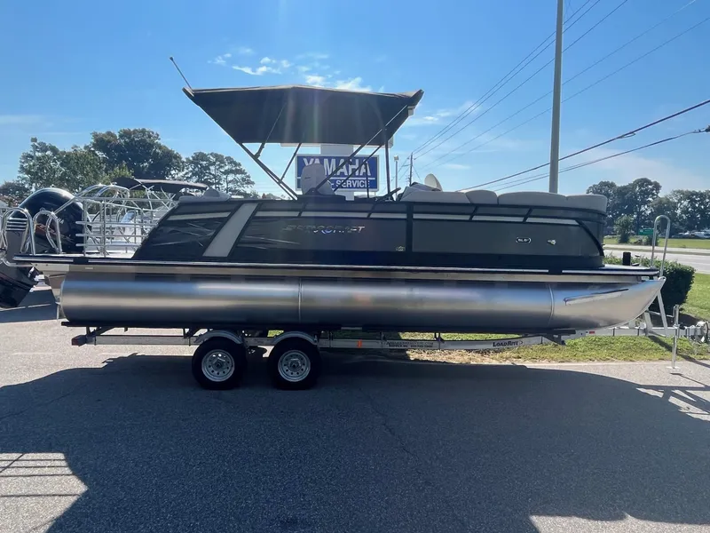 Slide: The Image of 2024 Starcraft SLS 3 Q DH pontoon boat on a trailer. - 1