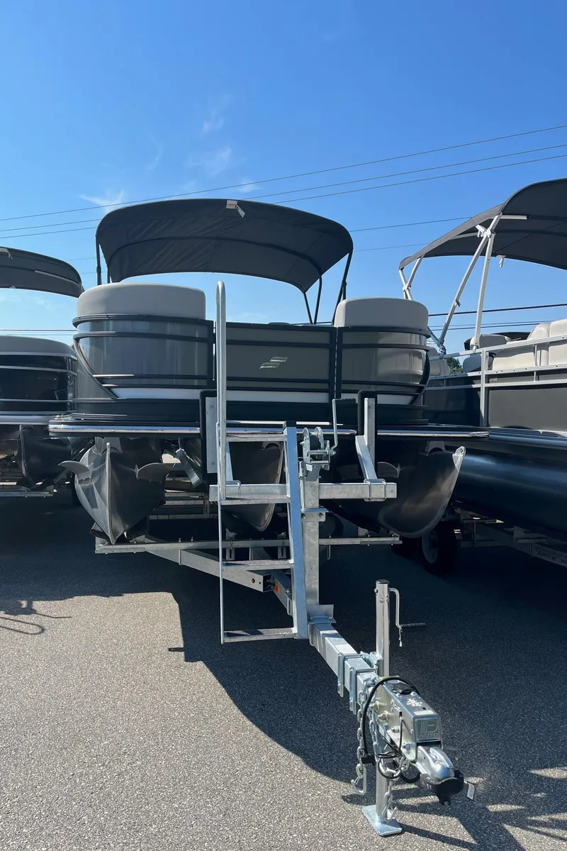 Slide: The Image of 2024 Starcraft SLS 3 Q DH pontoon boat on a trailer. - 3